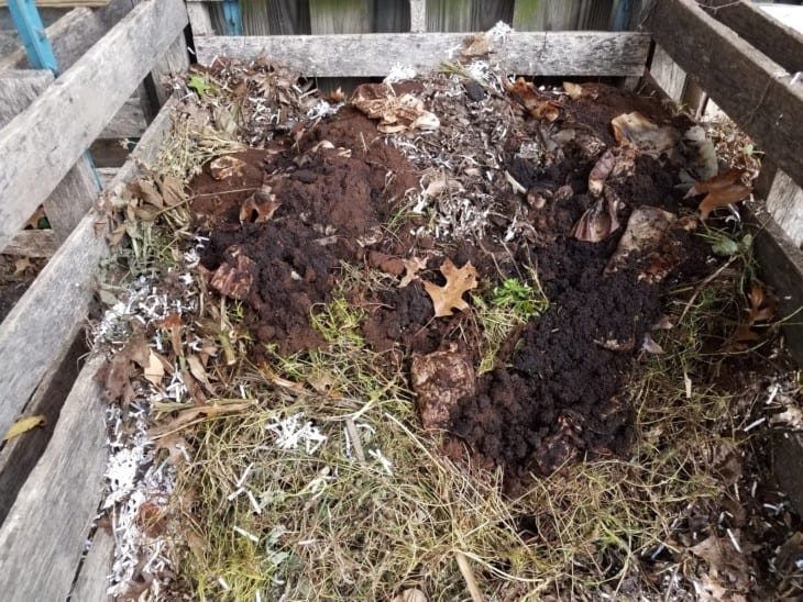 compost pile with dirt and coffee grounds